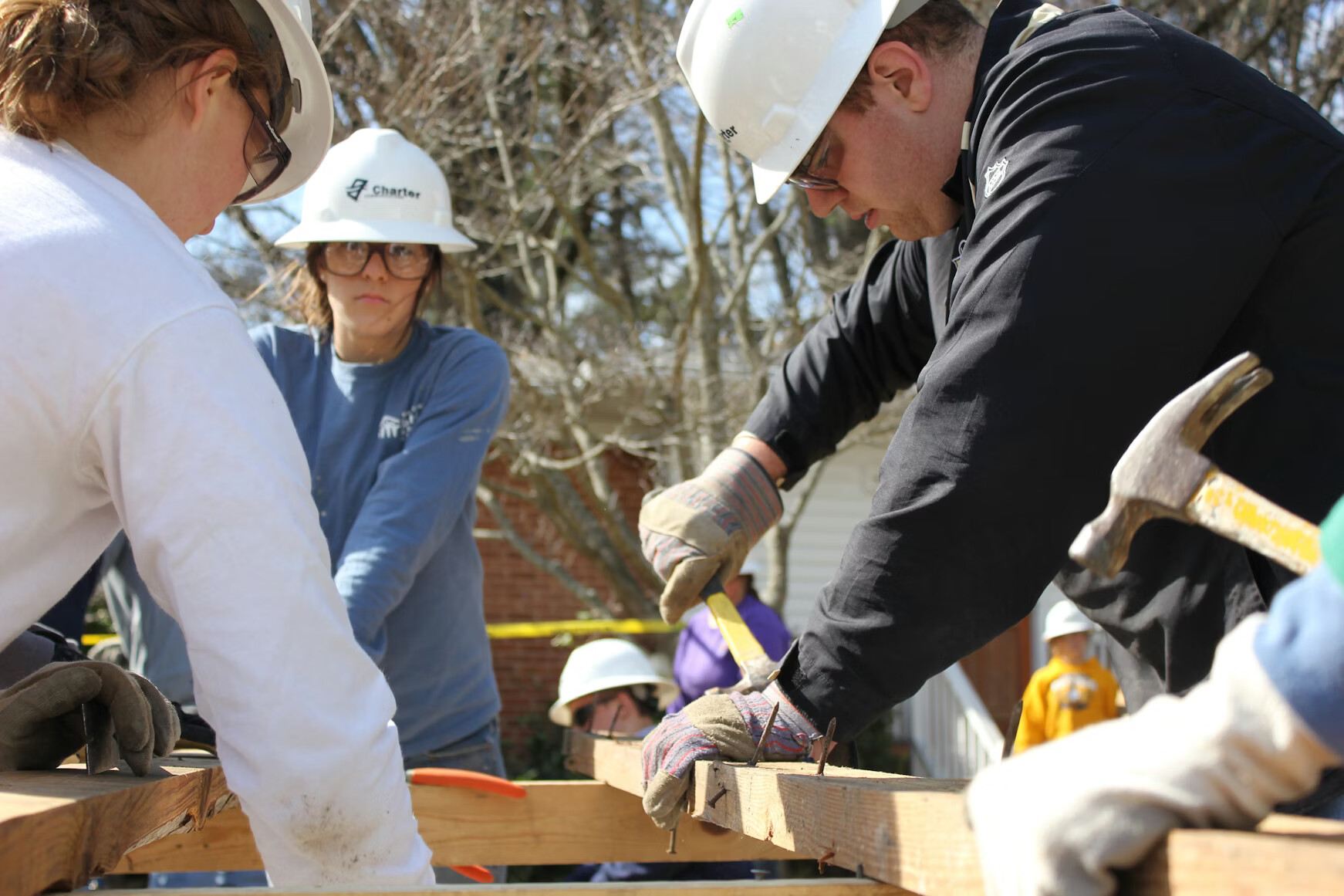 Carpenter cutting wood for repairs