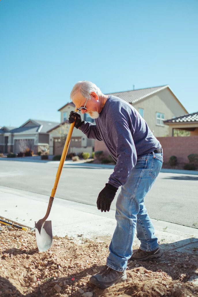 Volunteer holding a hard hat